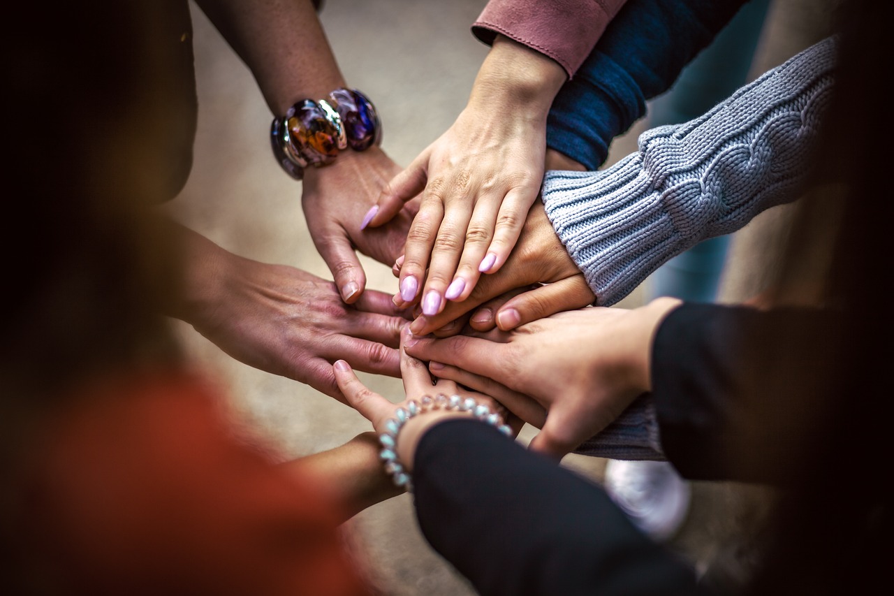 Women's hands in a circle